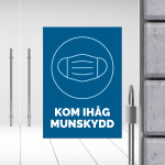 Kom ihåg munskydd – informationsskylt